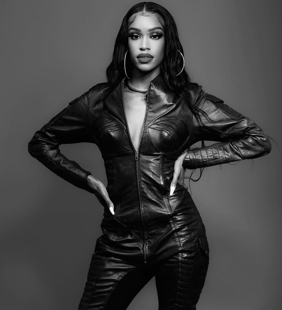 Premium Photo  The model wears a black leather jumpsuit by fashion business
